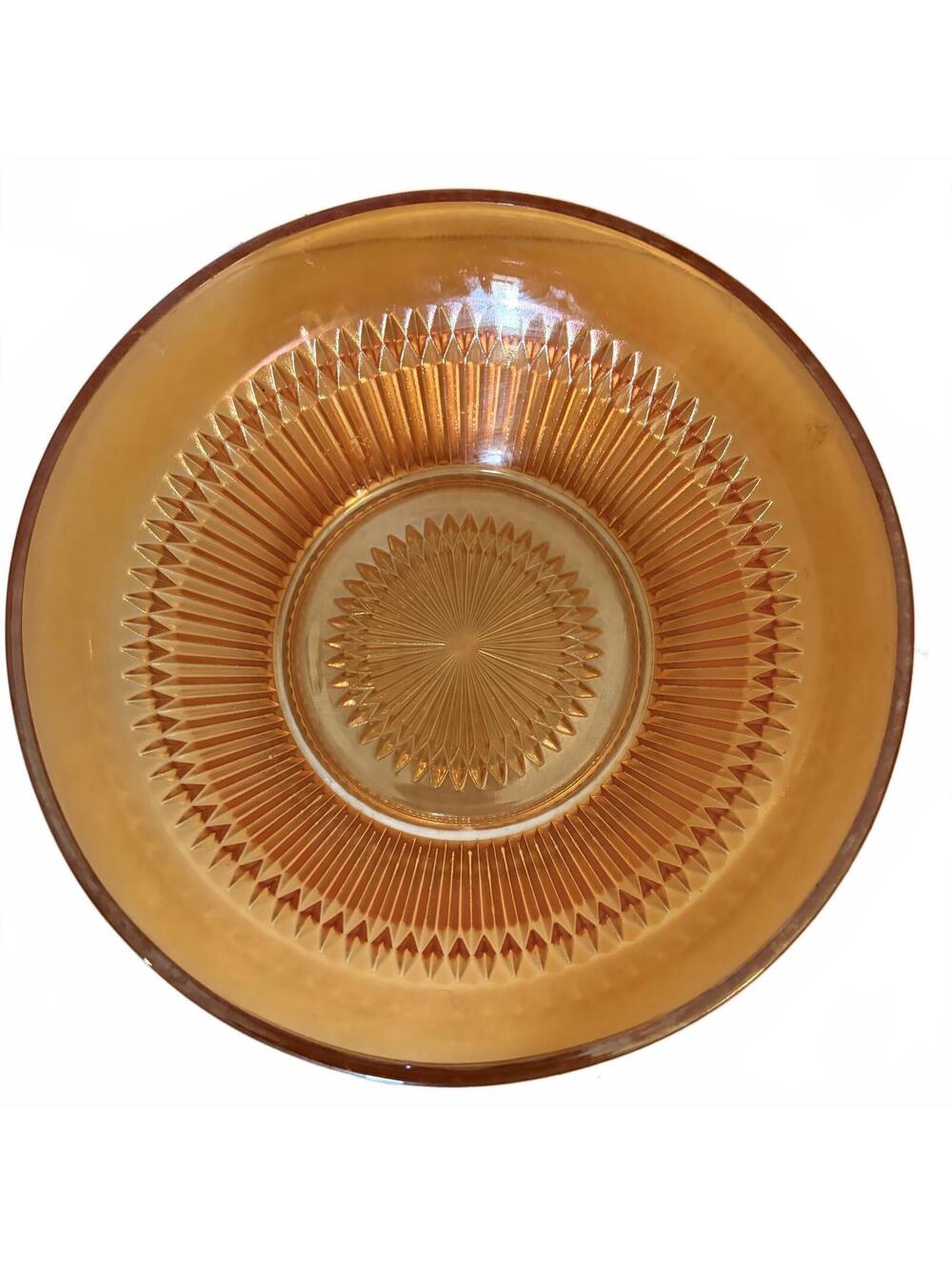 Jeannette marigold carnival glass bowl with a sunburst pattern